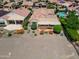 An aerial view of a backyard featuring a covered patio at 26725 W Marco Polo Rd, Buckeye, AZ 85396