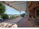 Back patio featuring desert views, seating, and drought resistant landscape plants at 26725 W Marco Polo Rd, Buckeye, AZ 85396