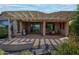 Enjoy outdoor living with a covered patio, grill, and scenic views, perfect for entertaining at 26725 W Marco Polo Rd, Buckeye, AZ 85396