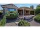 Beautiful backyard featuring a covered patio, desert landscaping, and charming cacti at 26725 W Marco Polo Rd, Buckeye, AZ 85396