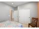 Bright bedroom with white trim and neutral colors, complete with double closets for storage at 26725 W Marco Polo Rd, Buckeye, AZ 85396