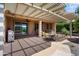 Expansive covered patio with outdoor dining, seating, barbecue and desert views at 26725 W Marco Polo Rd, Buckeye, AZ 85396
