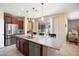 Spacious kitchen island with granite countertop, and stainless steel appliances at 26725 W Marco Polo Rd, Buckeye, AZ 85396
