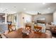 Open-concept space connects the kitchen, dining area, and living room with backyard access at 26725 W Marco Polo Rd, Buckeye, AZ 85396