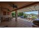 Spacious covered patio with ceiling fans, ideal for relaxing and entertaining; includes desert landscaping at 26725 W Marco Polo Rd, Buckeye, AZ 85396