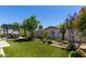 Backyard featuring custom stone and desert landscaping with artificial turf at 2835 E Donald Dr, Phoenix, AZ 85050