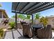 Outdoor backyard with patio cover, barbecue, and outdoor table and seating at 2835 E Donald Dr, Phoenix, AZ 85050
