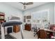 Multi-purpose room with exercise equipment, desk, and plantation shutters for natural light at 2835 E Donald Dr, Phoenix, AZ 85050
