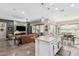 Spacious open-concept layout with a kitchen island overlooking the living room and fireplace at 2835 E Donald Dr, Phoenix, AZ 85050
