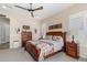 Spacious main bedroom featuring a ceiling fan, neutral walls, and a stylish quilt-covered bed at 2835 E Donald Dr, Phoenix, AZ 85050
