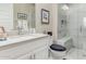 Well-appointed powder room with a shower with bench and contemporary fixtures and decor at 2835 E Donald Dr, Phoenix, AZ 85050