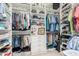 Organized walk-in closet with ample shelving, hanging space, and built-in drawers at 2835 E Donald Dr, Phoenix, AZ 85050