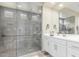 Modern bathroom featuring a walk-in shower with a rainfall showerhead and a built-in seat at 2835 E Donald Dr, Phoenix, AZ 85050
