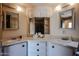Bright bathroom features a vanity with dual sinks and ample counter space at 303 S Recker Rd # 29, Mesa, AZ 85206