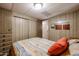 Comfortable bedroom with good-sized closet, carpeted floor, and paneled walls at 303 S Recker Rd # 29, Mesa, AZ 85206
