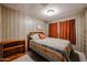 Modest bedroom with wood-paneled walls, and carpeted flooring at 303 S Recker Rd # 29, Mesa, AZ 85206