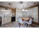 The kitchen includes a dining area, appliances, wood cabinets, and a window for natural light at 303 S Recker Rd # 29, Mesa, AZ 85206