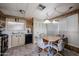 The kitchen includes a dining area, appliances, wood cabinets, and a window for natural light at 303 S Recker Rd # 29, Mesa, AZ 85206