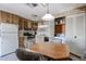 The kitchen includes a dining area, appliances, wood cabinets, and a laundry area at 303 S Recker Rd # 29, Mesa, AZ 85206