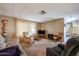 The living room features carpeted floors and neutral wood paneled walls offering a comfortable and relaxing living space at 303 S Recker Rd # 29, Mesa, AZ 85206