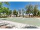 Outdoor basketball court provides recreational space, with trees and residential buildings in the background at 3109 N Black Rock Rd, Buckeye, AZ 85396