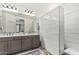 Beautiful bathroom featuring double sinks with large mirrors and separate shower at 3109 N Black Rock Rd, Buckeye, AZ 85396