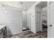 Bright bathroom featuring tile shower and views into the main bedroom at 3109 N Black Rock Rd, Buckeye, AZ 85396