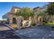 Beautiful community center with Spanish style architecture surrounded by lush trees and landscaping at 3109 N Black Rock Rd, Buckeye, AZ 85396