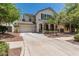 Charming two-story home with a welcoming front porch, well-manicured landscaping, and a convenient two-car garage at 3109 N Black Rock Rd, Buckeye, AZ 85396