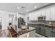 Spacious kitchen featuring a large island, sleek countertops, and stainless steel appliances at 3109 N Black Rock Rd, Buckeye, AZ 85396