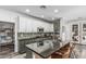 Well-equipped kitchen with a large island, stainless steel appliances, and elegant backsplash at 3109 N Black Rock Rd, Buckeye, AZ 85396