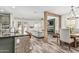 Inviting living area with a fireplace and dining area with a view of the kitchen at 3109 N Black Rock Rd, Buckeye, AZ 85396