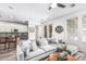 Bright living room featuring a comfortable sectional sofa and stylish decor with view into the kitchen at 3109 N Black Rock Rd, Buckeye, AZ 85396