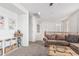 Inviting living room with a sectional sofa, built-in shelving, and neutral décor creating a cozy atmosphere at 3109 N Black Rock Rd, Buckeye, AZ 85396