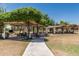 Green common park area with covered picnic tables for Gathering gatherings at 3109 N Black Rock Rd, Buckeye, AZ 85396