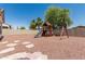 This expansive backyard comes complete with a playset, slide, and swings at 3109 N Black Rock Rd, Buckeye, AZ 85396