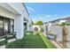 Private backyard featuring artificial turf, pavers, mature landscaping, and a modern design at 3136 E Cheryl Dr, Phoenix, AZ 85028
