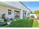 Stylish backyard with artificial turf, patio, and hanging chair, creating a perfect outdoor retreat at 3136 E Cheryl Dr, Phoenix, AZ 85028