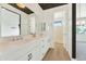 Bright bathroom with double sink vanity, ample counter space, modern faucets, and a glass enclosed shower at 3136 E Cheryl Dr, Phoenix, AZ 85028