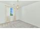Minimalist bedroom with plush carpeting and a contemporary pendant light fixture at 3136 E Cheryl Dr, Phoenix, AZ 85028