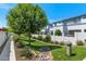 Lush community park with mature tree, green lawn, benches, and walking path at 3136 E Cheryl Dr, Phoenix, AZ 85028