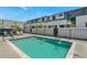 Community pool with lounge chairs, splash features, and secure fencing, perfect for relaxation at 3136 E Cheryl Dr, Phoenix, AZ 85028