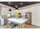 Stylish kitchen featuring white cabinets, stainless appliances, a kitchen island, and modern pendant lighting at 3136 E Cheryl Dr, Phoenix, AZ 85028