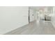 Bright living room boasts light wood floors, neutral paint, modern chandelier, and staircase to upper level at 3136 E Cheryl Dr, Phoenix, AZ 85028
