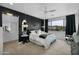 Comfortable main bedroom featuring a ceiling fan, large window with mountain views, and an attached bathroom at 3136 E Cheryl Dr, Phoenix, AZ 85028