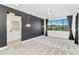 Spacious main bedroom featuring a ceiling fan, large window with mountain views, and an attached bathroom at 3136 E Cheryl Dr, Phoenix, AZ 85028