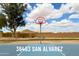 Community basketball court with a well-maintained surface and a backdrop of neighborhood homes at 36463 W San Alvarez Ave, Maricopa, AZ 85138
