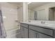 Bathroom featuring double vanity sinks with modern fixtures and a shower-tub combination at 36463 W San Alvarez Ave, Maricopa, AZ 85138