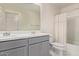 Well-lit bathroom with a dual vanity, modern fixtures, and a clean shower and tub combo at 36463 W San Alvarez Ave, Maricopa, AZ 85138