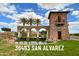 Community entrance featuring stonework, desert landscaping, and water feature at 36463 W San Alvarez Ave, Maricopa, AZ 85138